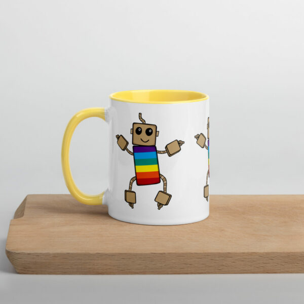 ned ceramic mug with yellow insides and rainbow ned printed on the outside