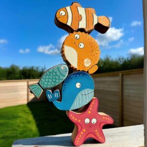 under the sea bundle. stacked wooden fish featuring a clown fish, puffer fish, little fish, blue whale and star fish