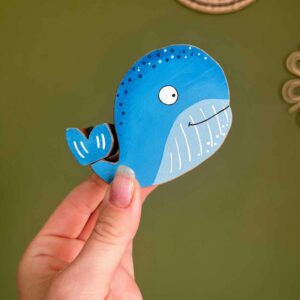 Blue whale wooden toy with spinny tail