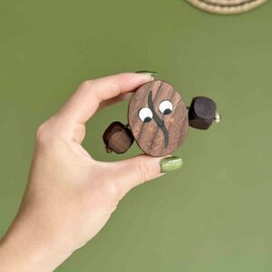 walnut coffee bean with face and arms
