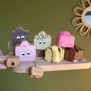 Wooden fondant fancy toy made from oak, part of a pretend play bakery set.