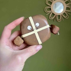 Hand painted wooden hot cross bun character with raisin details by Rudi and Bear