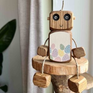 Hand painted wooden Easter Ned robot with pastel egg belly by Rudi and Bear