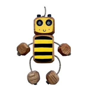 Handcrafted wooden bee Nedlet toy made from solid oak, with yellow and black striped body, rope arms and legs, and a hand-painted smiling face on a neutral background.